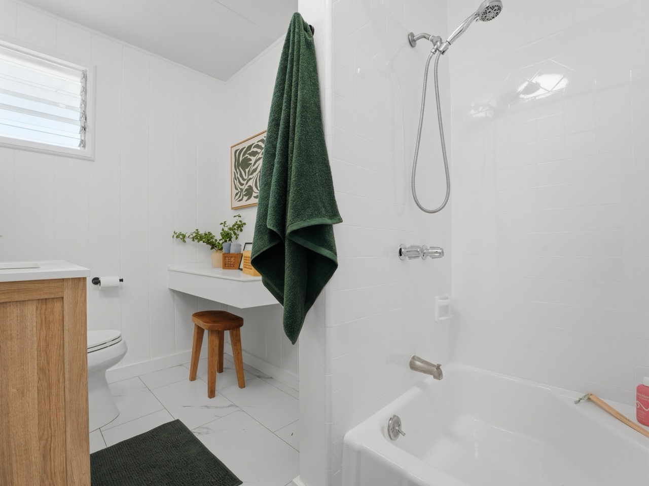 Tub and shower combo with white tile surround