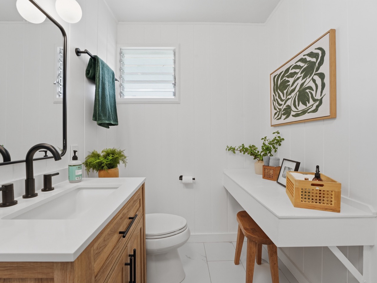 Full bath vanity with wood cabinet and botanical art
