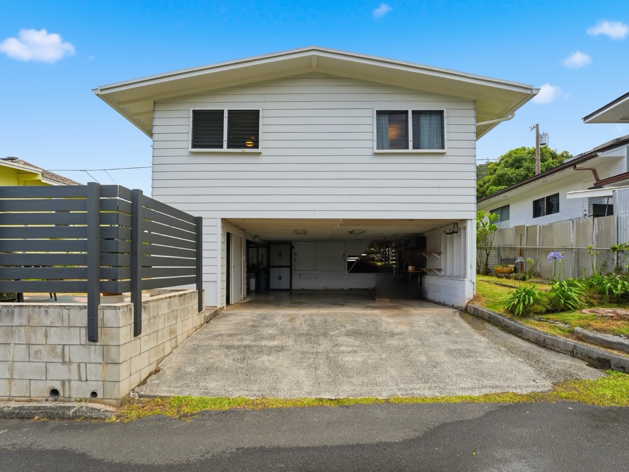 Driveway and 2-car carport from front