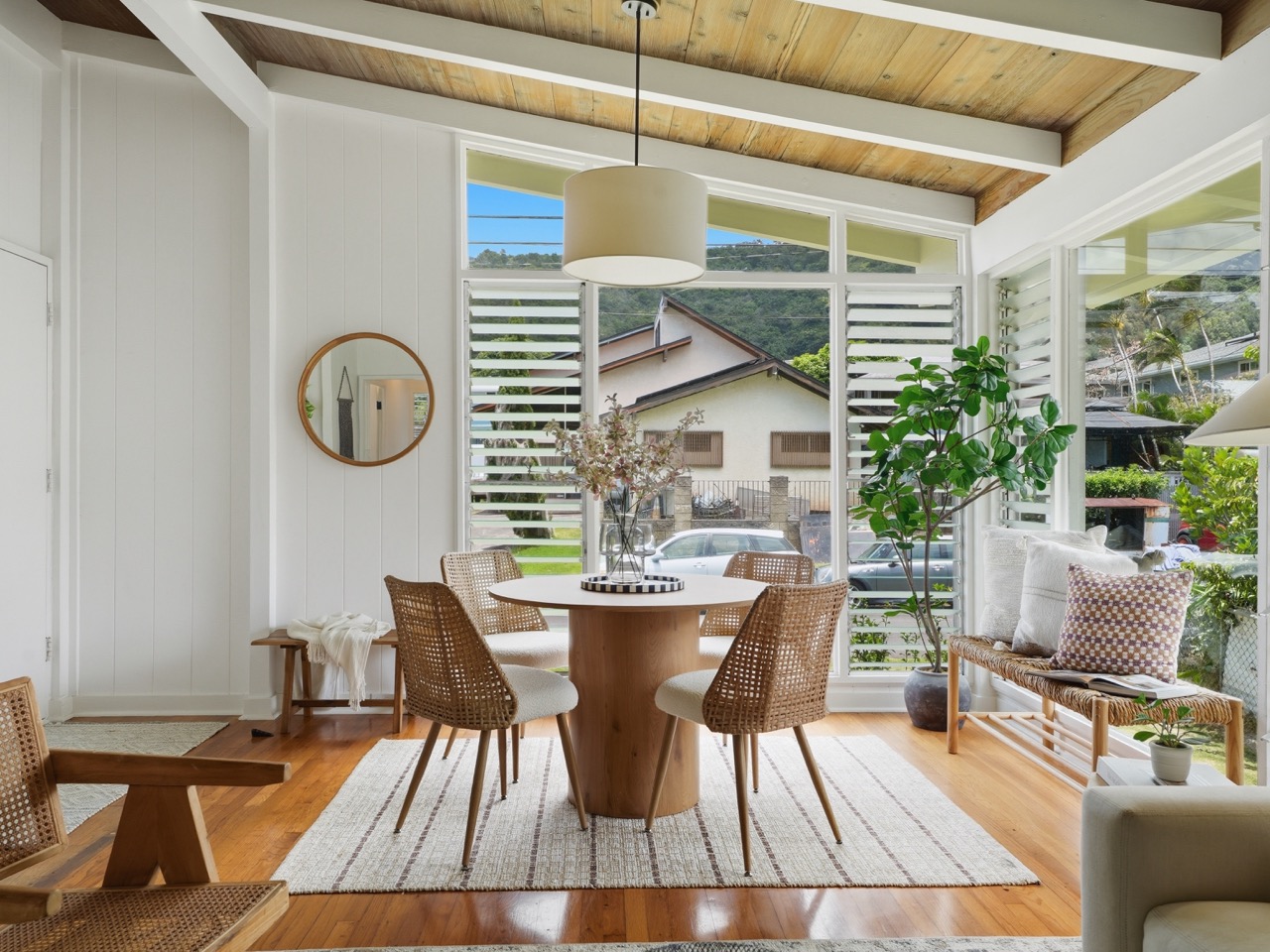 Dining nook with floor-to-ceiling louvered windows