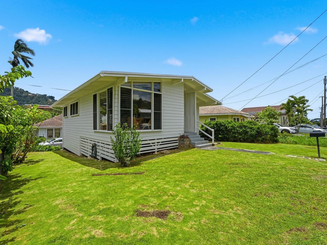 Side exterior view with grassy lawn