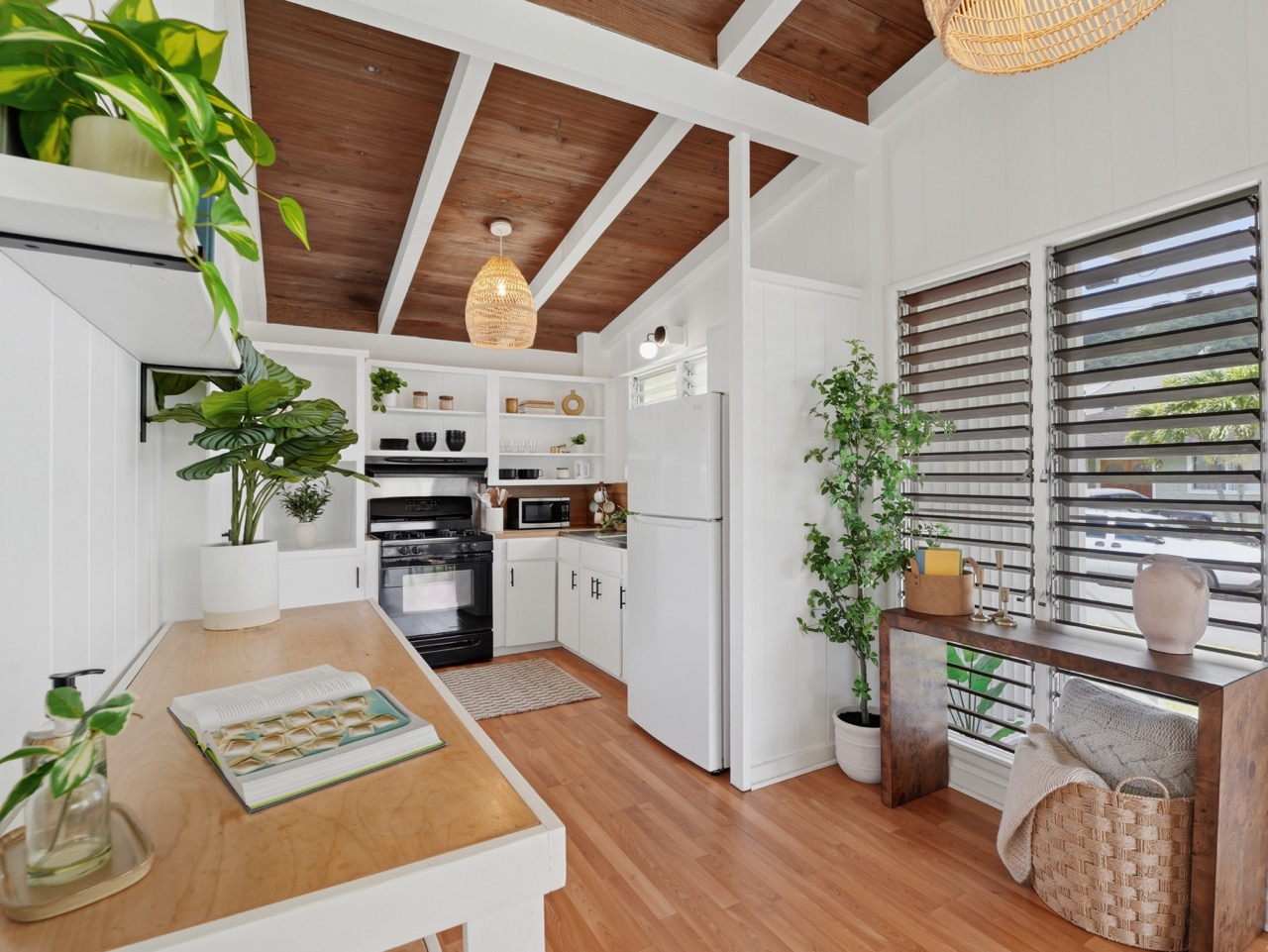 Kitchen view with vaulted wood ceiling and pothos plants