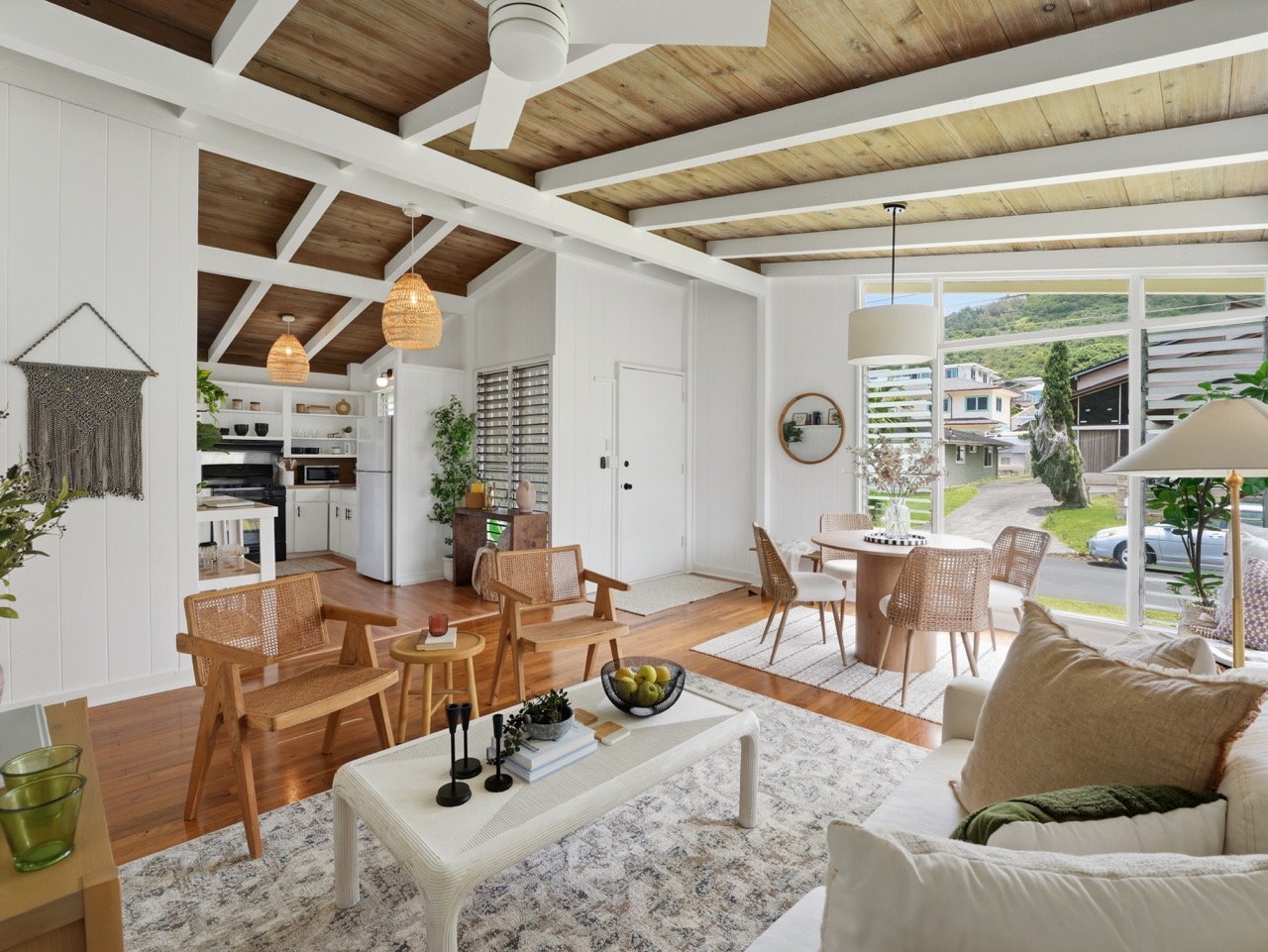Open living and kitchen with vaulted beamed ceiling